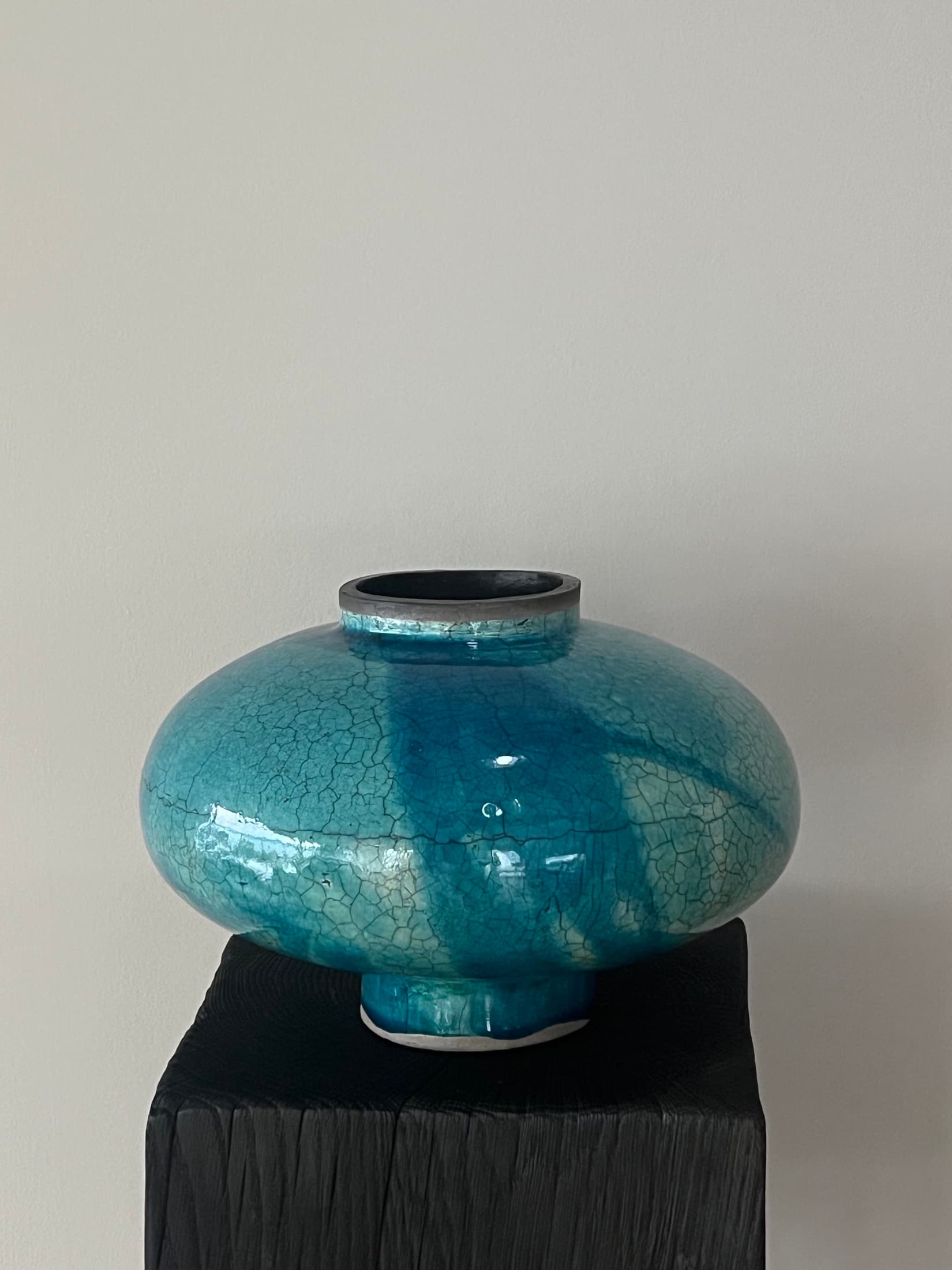 Bulbous vase with a glossy turquoise-blue crackle glaze